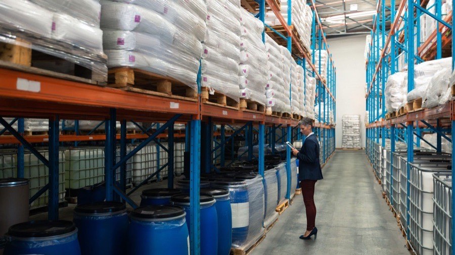 Warehouse racking with bagged industrial chemicals and drums