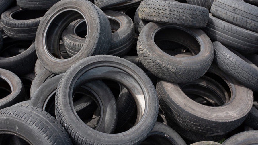 Pile of used passenger car radial tyres